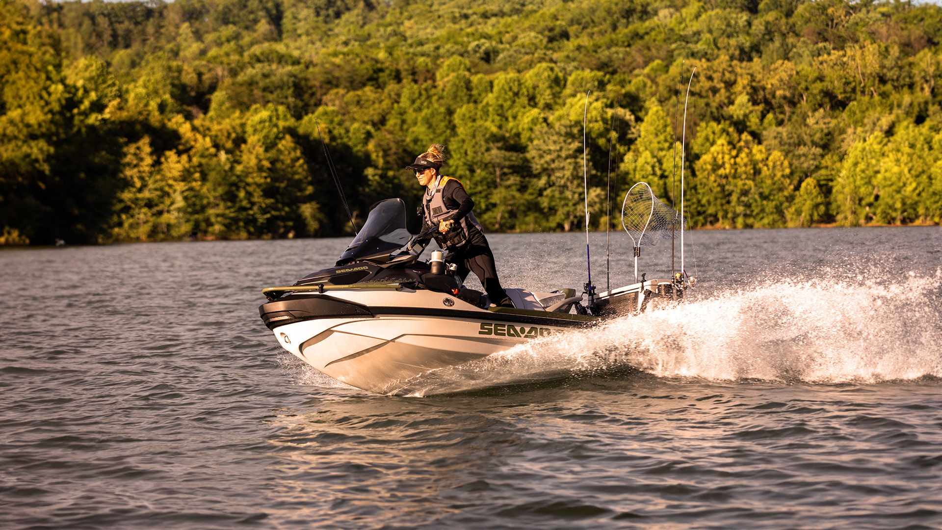 Woman in Sea-Doo life jacket storing items in the hull of her Sea-Doo PWC