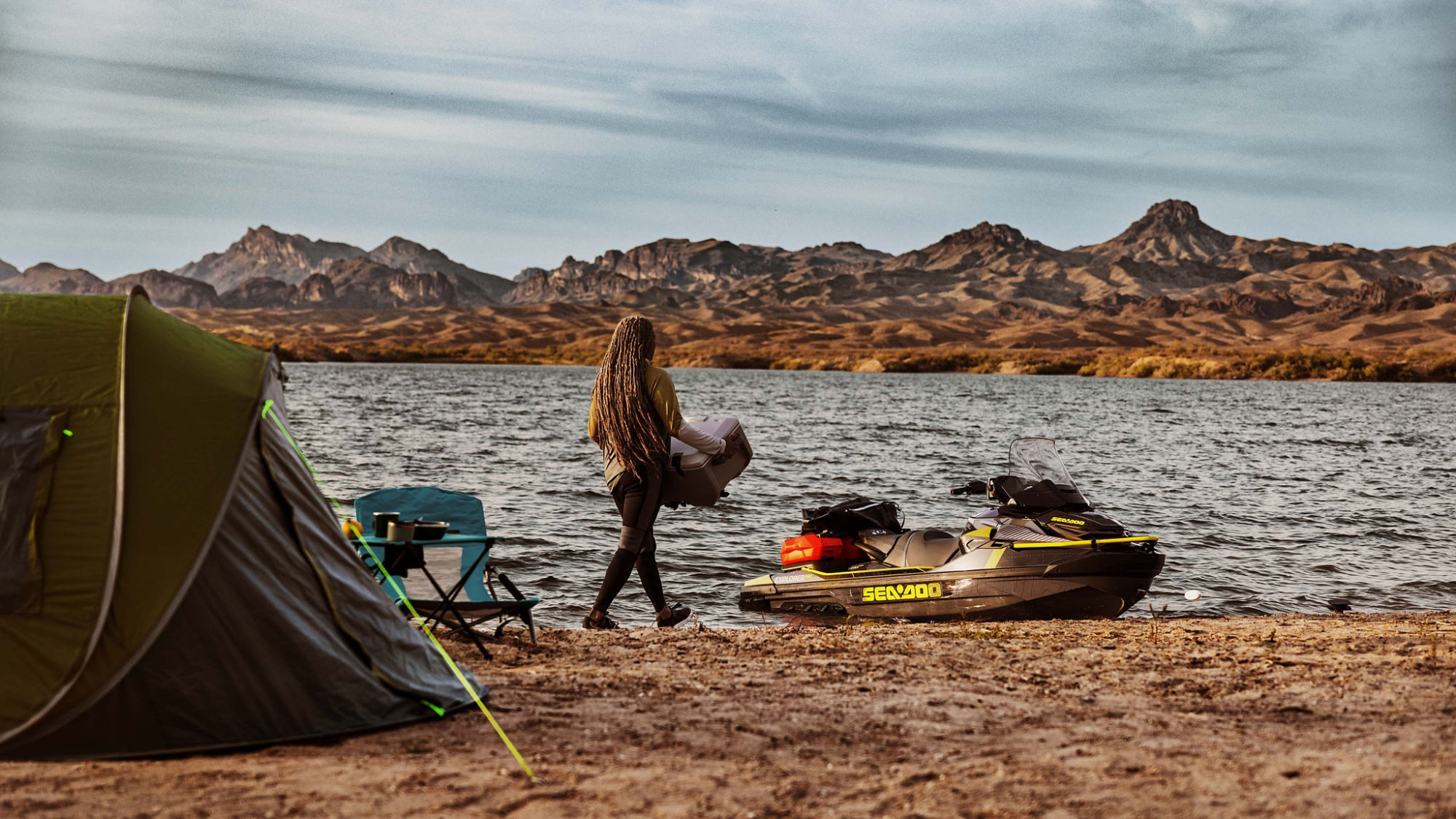 Man packing camping gear on a Sea-Doo Explorer Pro 2025