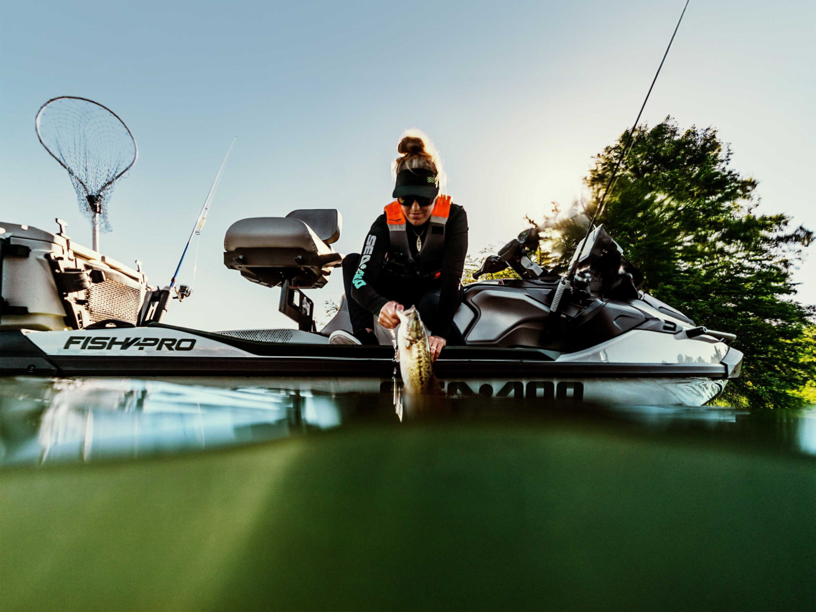 A woman fishing from her 2025 Sea-Doo FishPro Apex personal watercraft