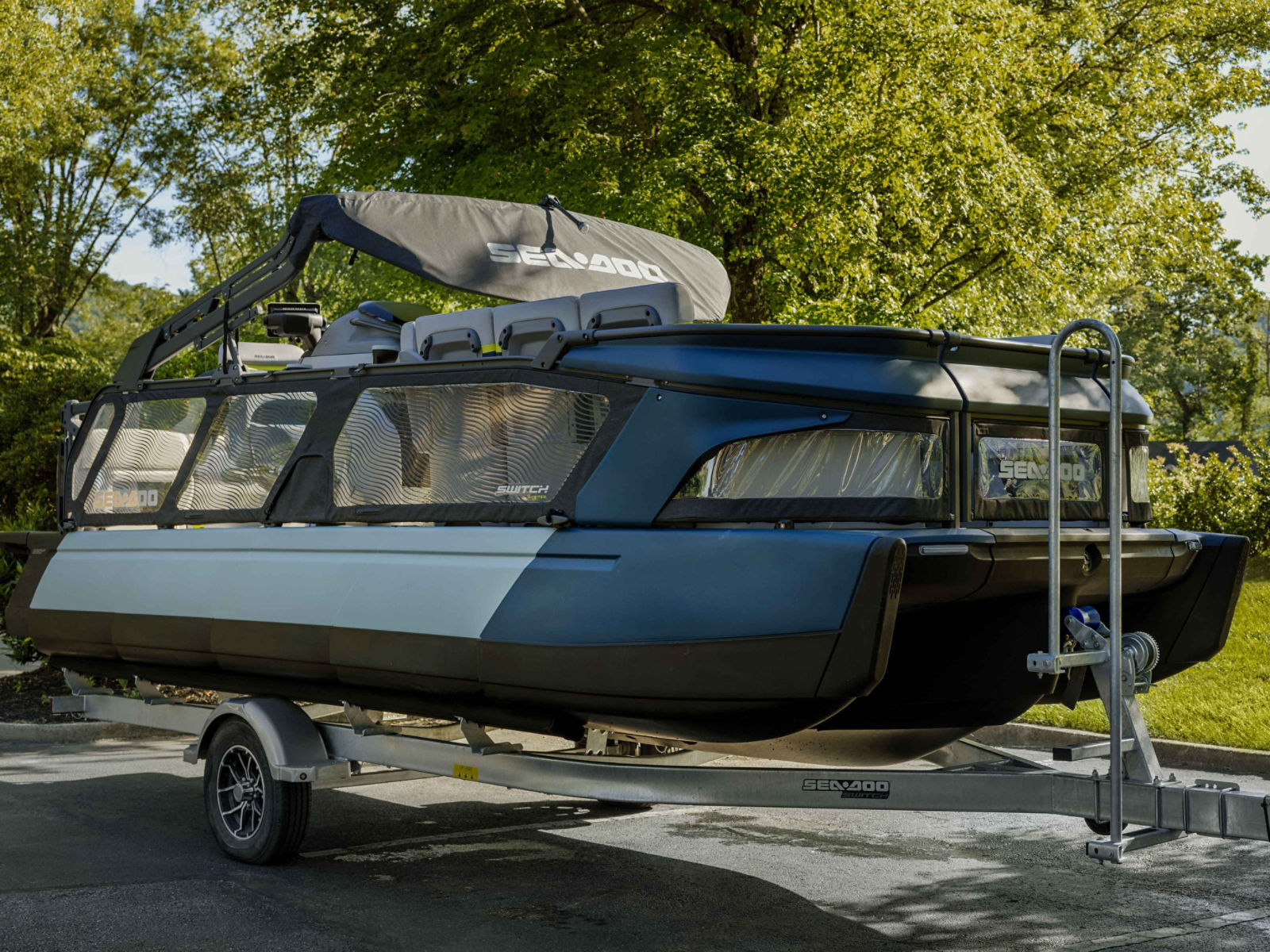 A 2025 Sea-Doo Switch Limited pontoon boat on a trailer