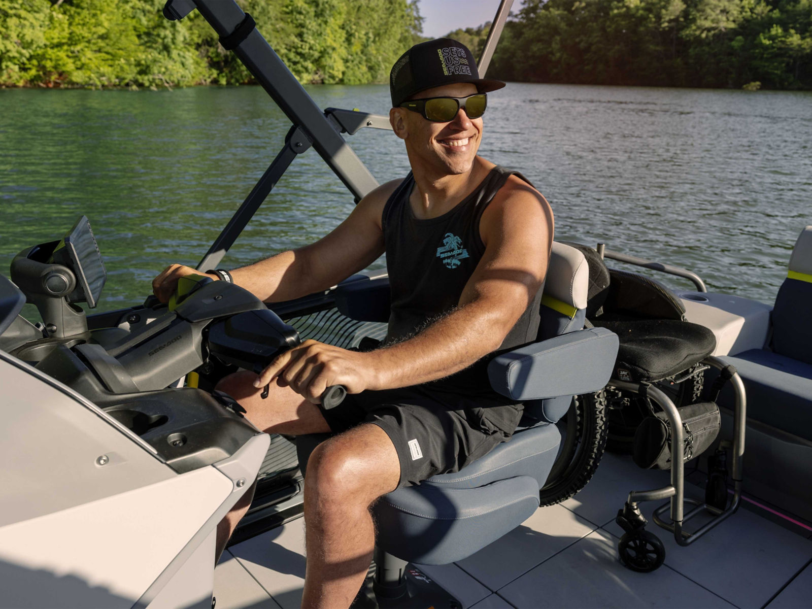 A man riding the 2025 Sea-Doo Switch Limited pontoon boat