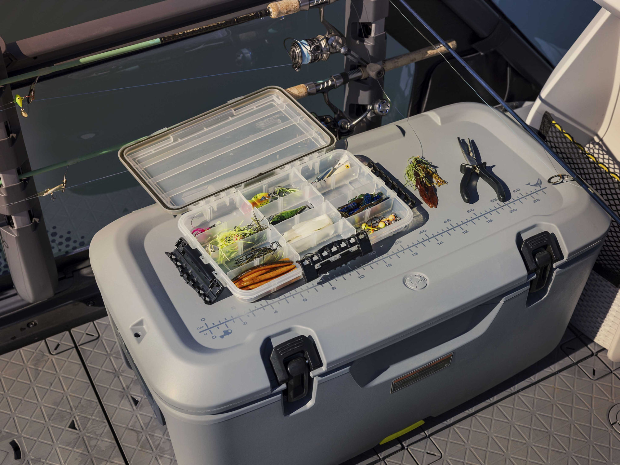 Men attaching a LinQ cooler on a Sea-Doo Switch pontoon