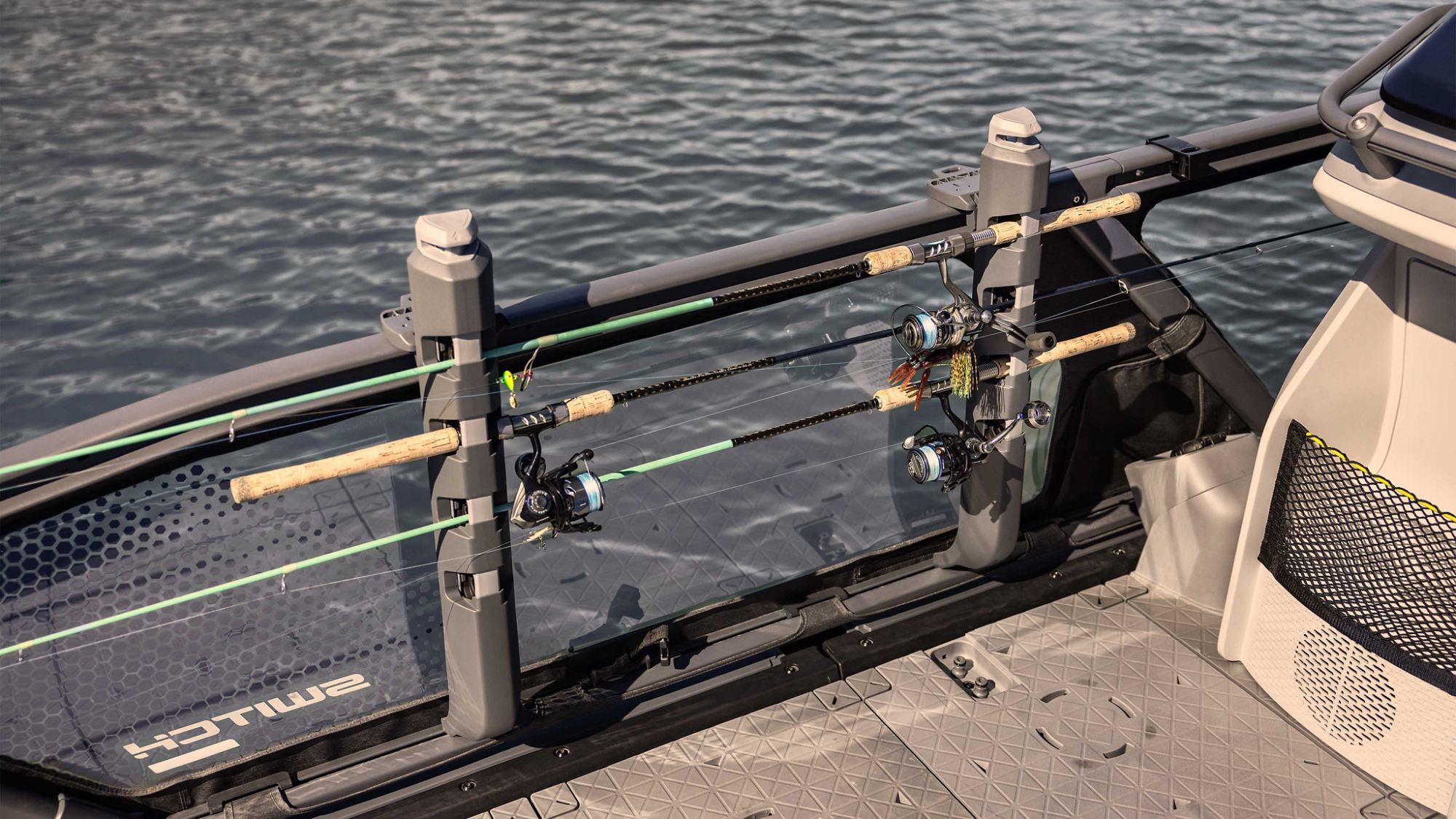 3 fishing rods installed on a support on the 2025 Sea-Doo Switch Fish pontoon boat