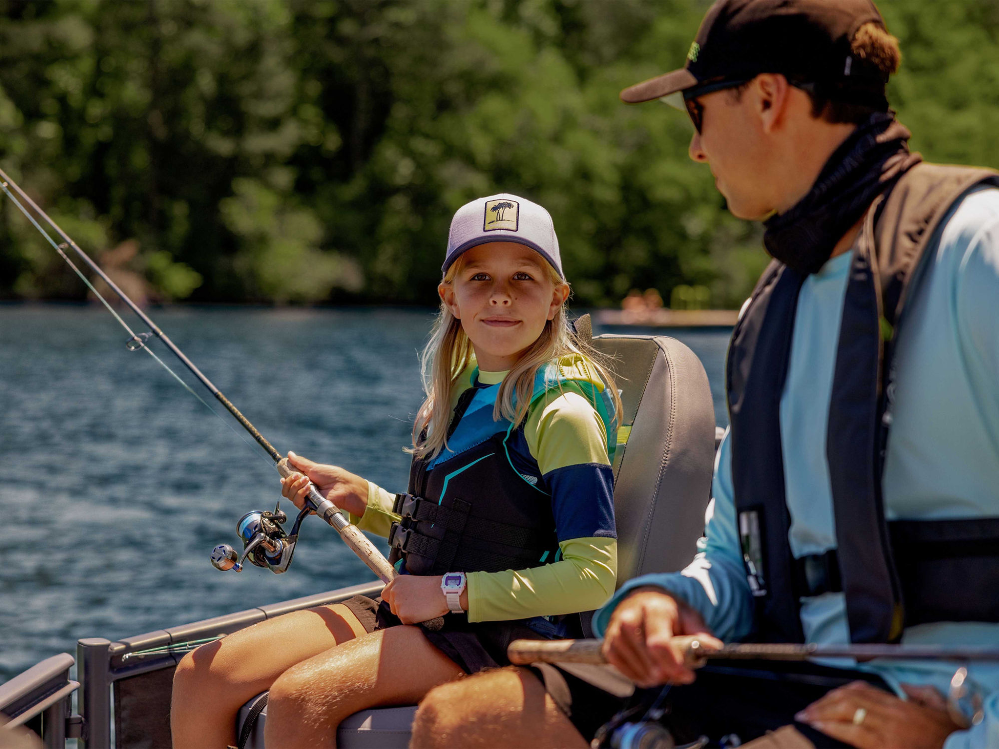 Women zipping up her kid Sea-Doo PFD