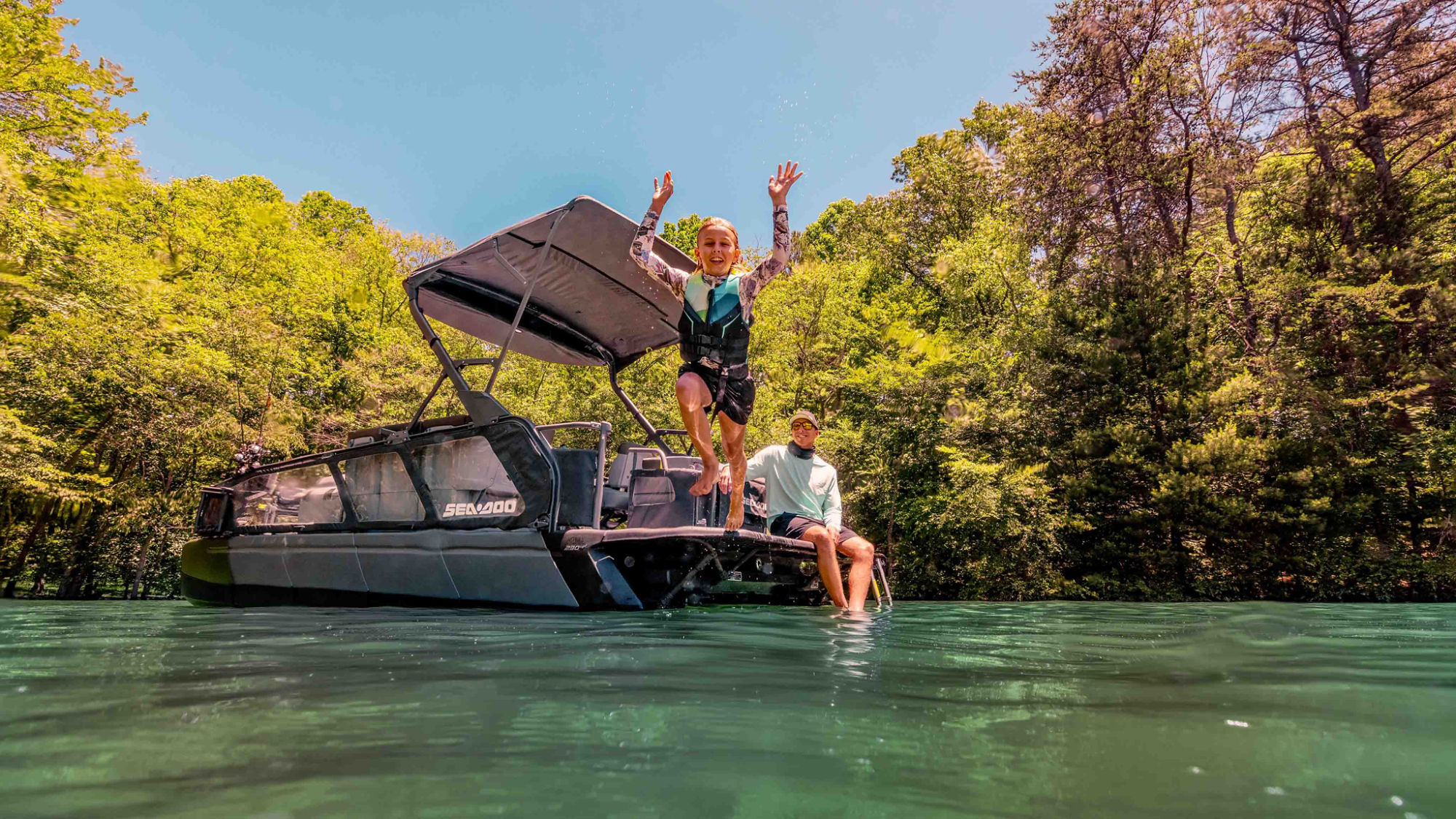 Family having fun on their Sea-Doo Switch pontoon boat