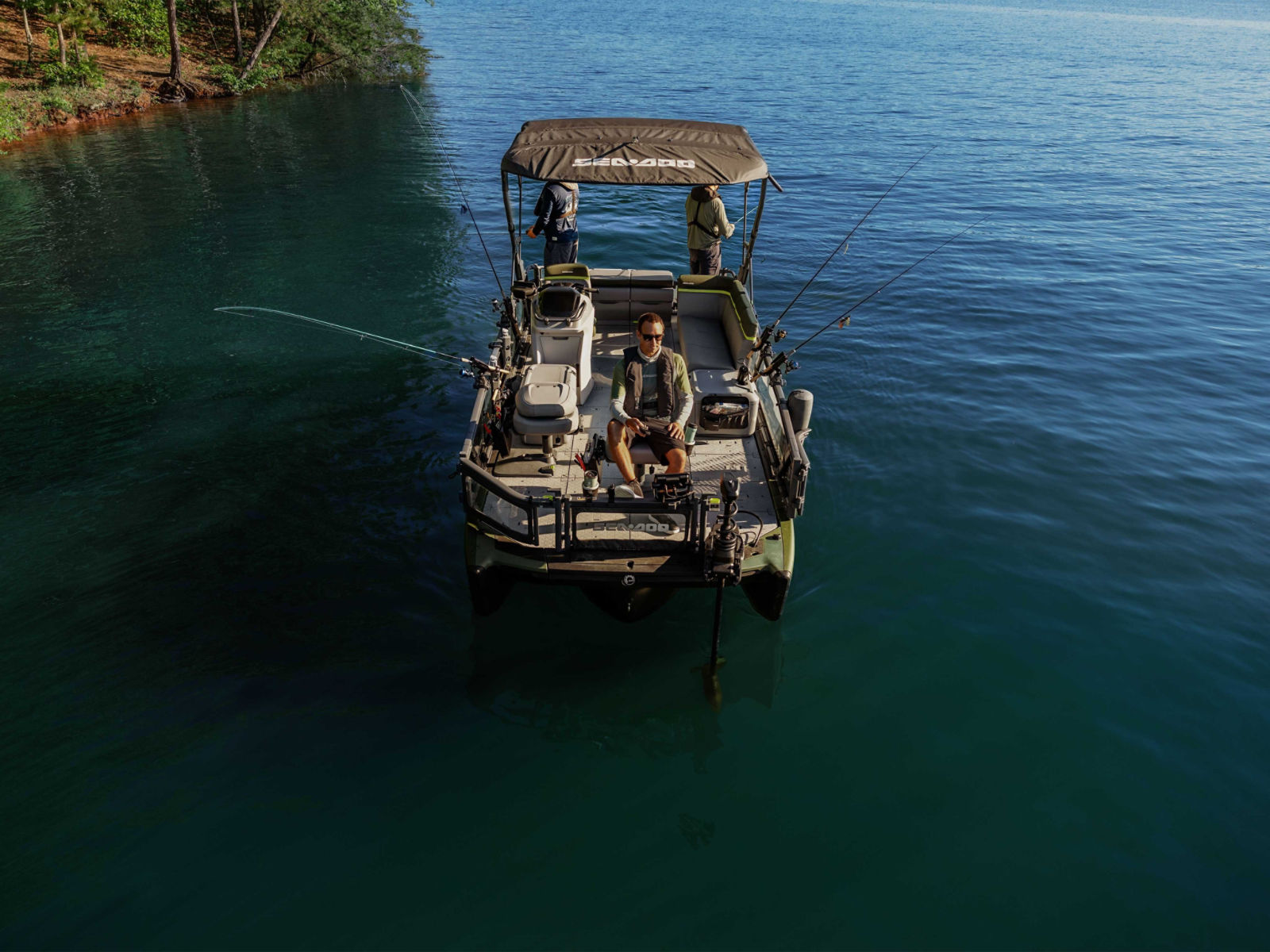 Three men fishing from the 2025 Sea-Doo Switch Fish pontoon boat