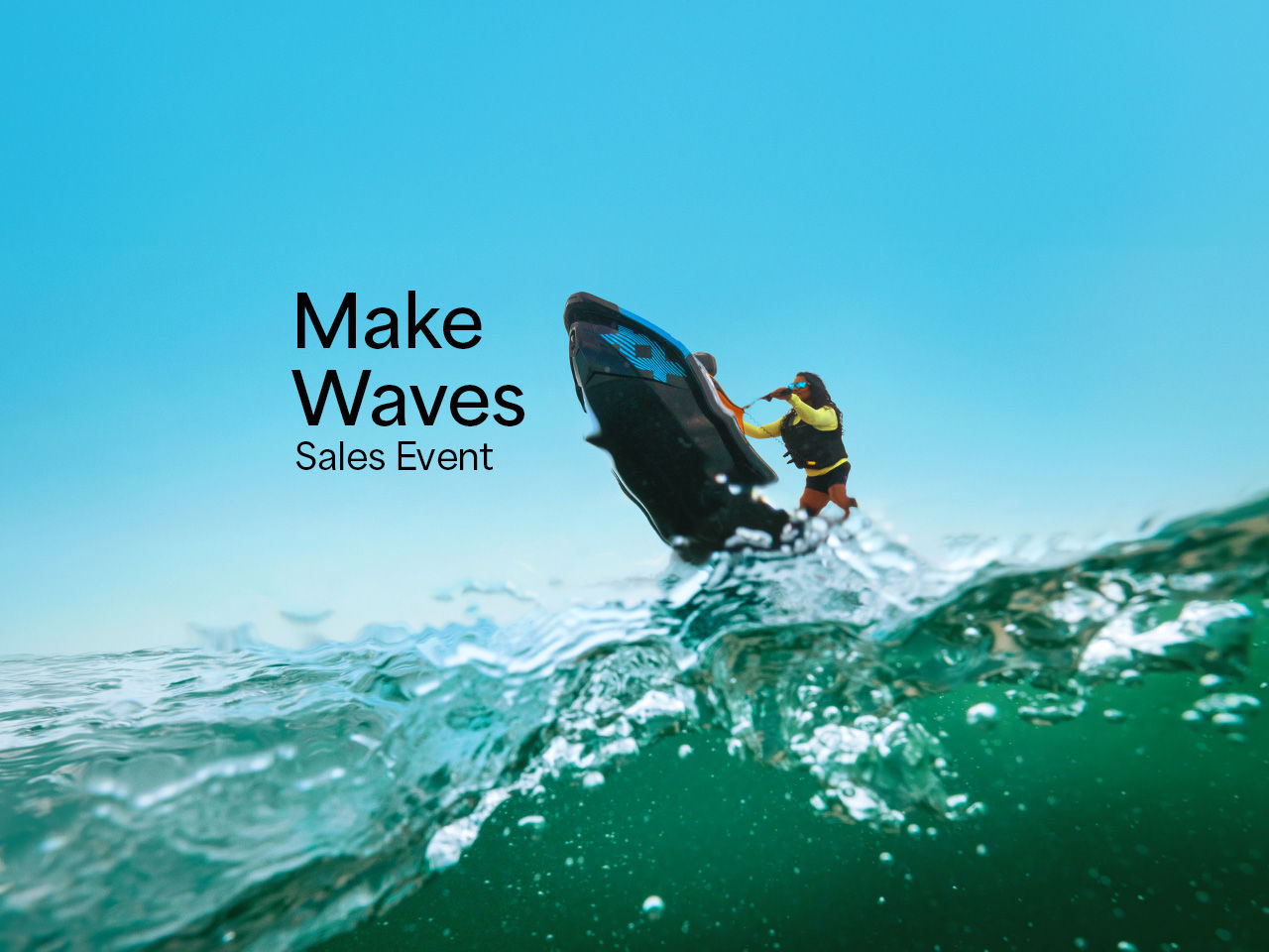 A woman performing a stunt on her Sea-Doo Spark with the words “Make Waves sales event”