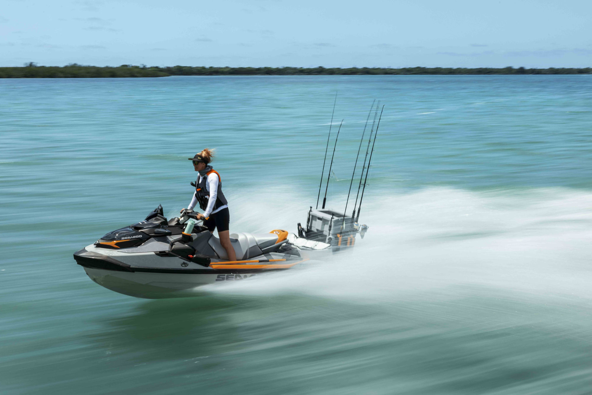 A woman riding a 2026 Sea-Doo FishPro Trophy