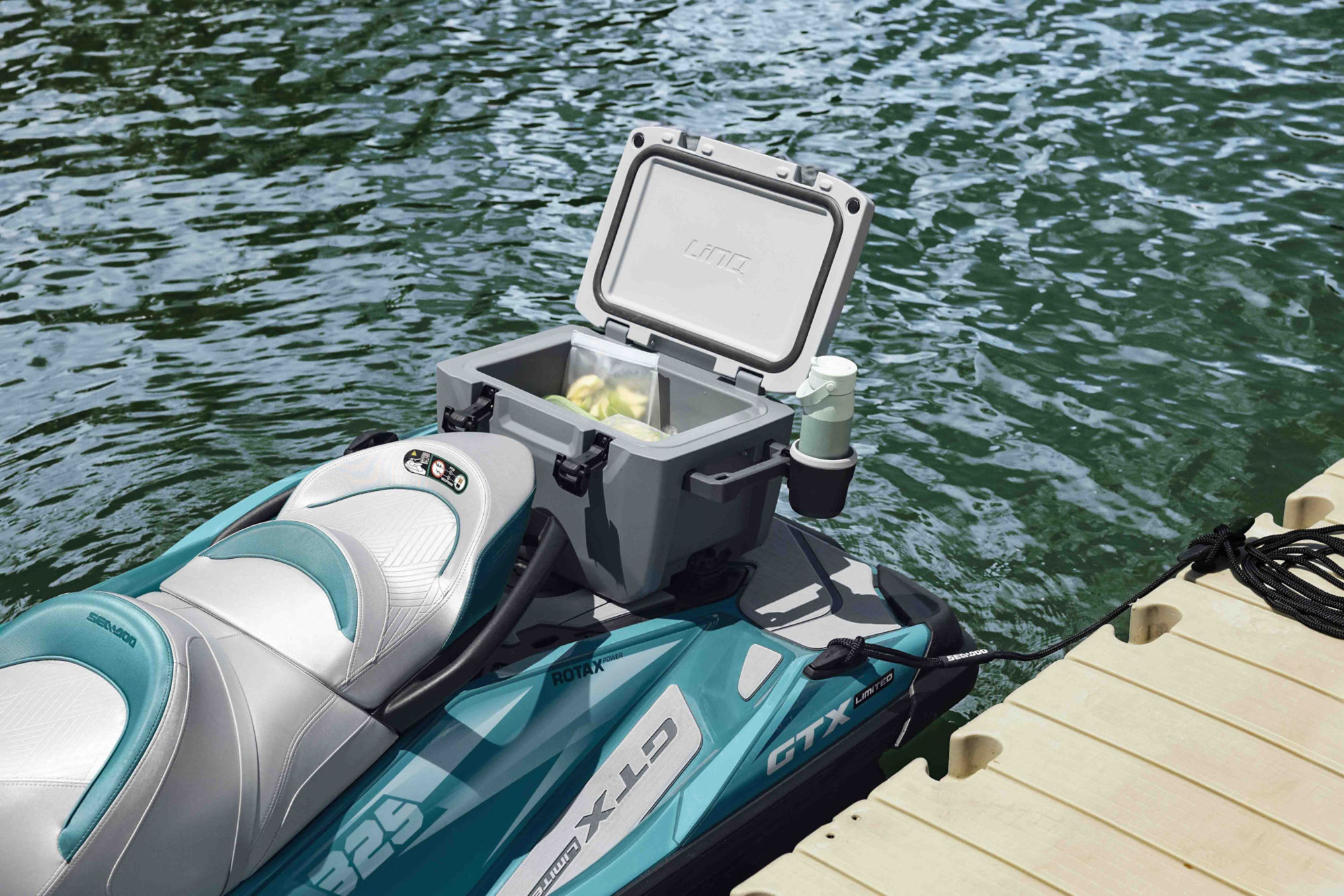 Woman using the LinQ cooler on a 2025 Sea-Doo GTX Limited