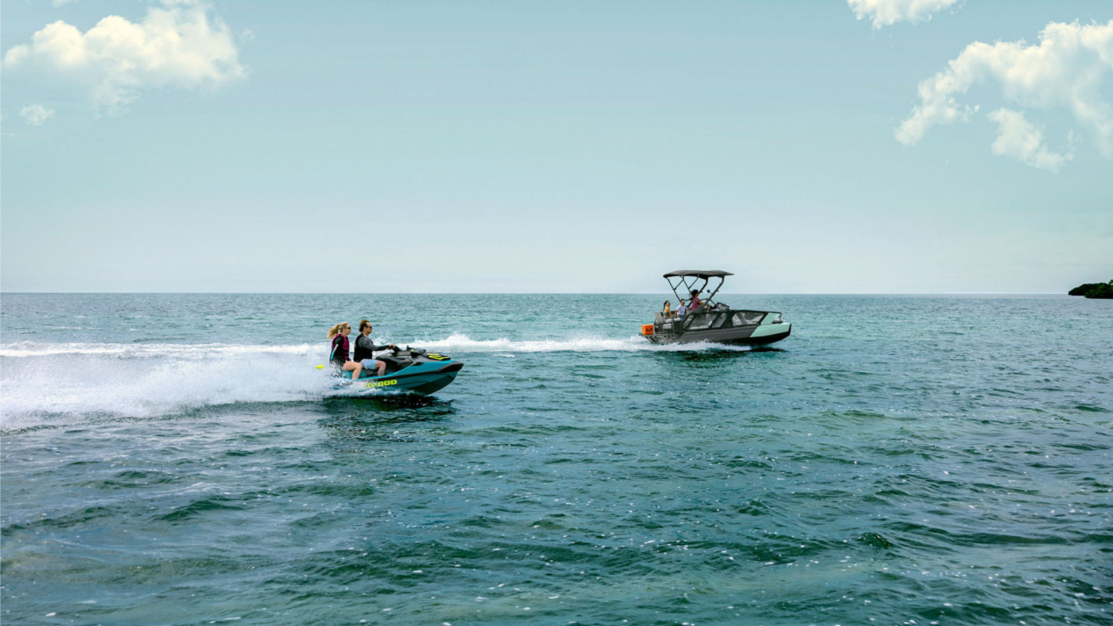 People riding a Sea-Doo PWC and pontoon on deep blue water.