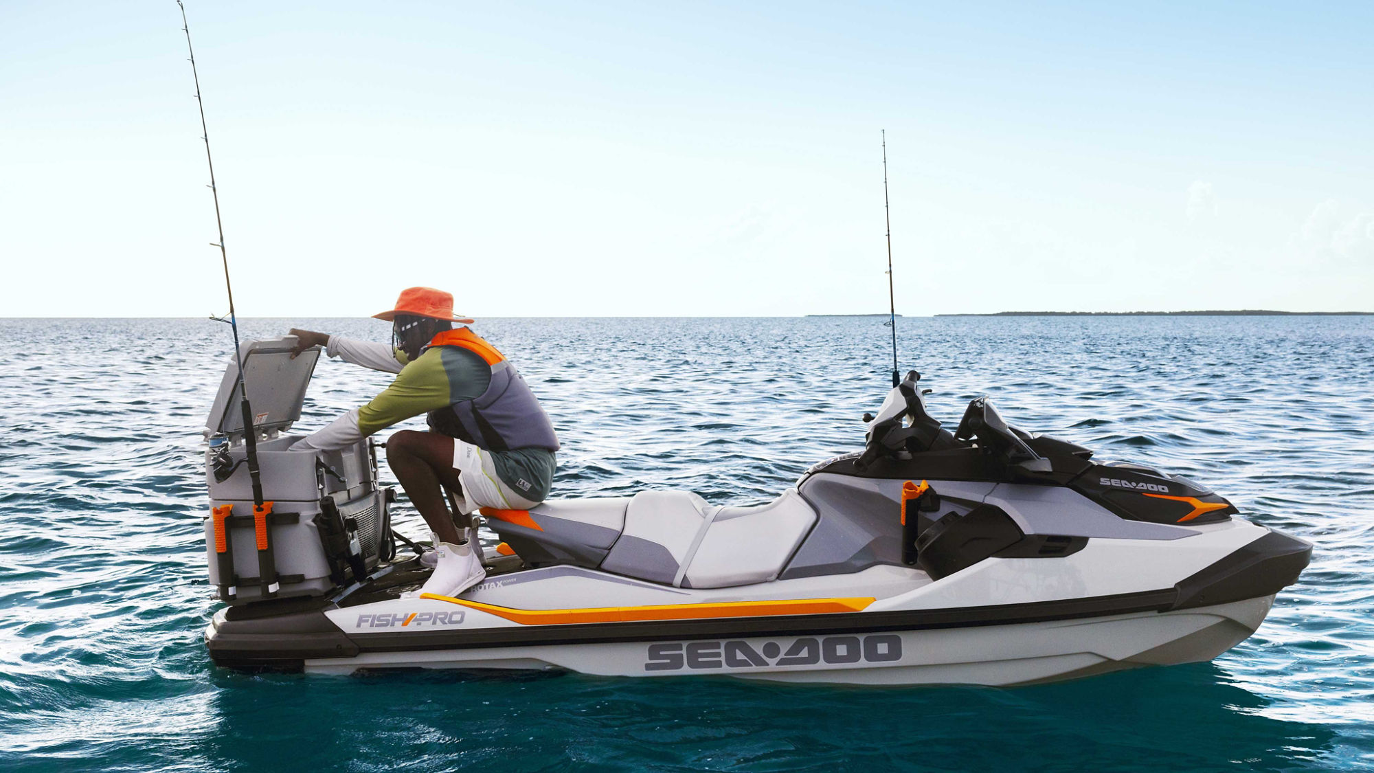 Men reaching for his LinQ cooler on a Sea-Doo FishPro Trophy