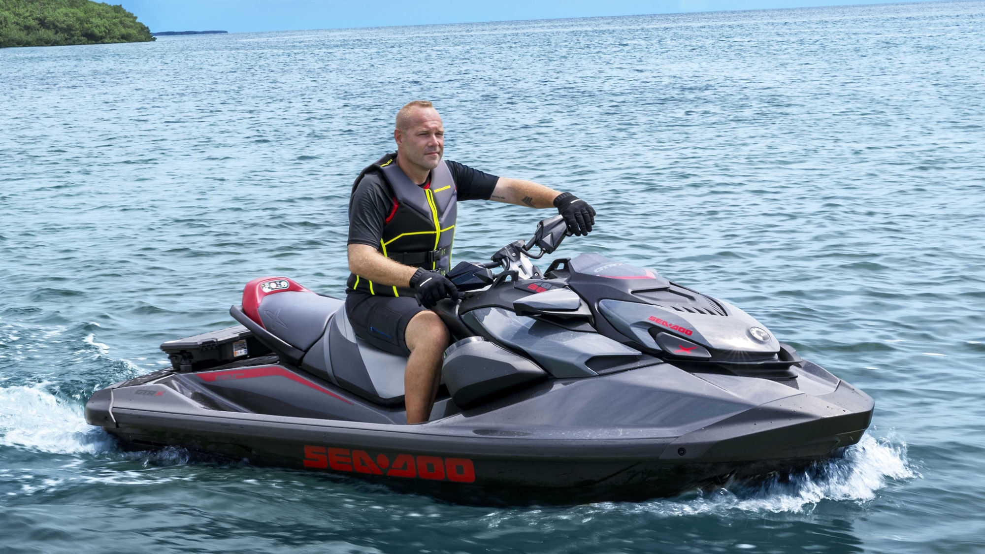 Women reaching out to the storage of her 2024 Sea-Doo GTR