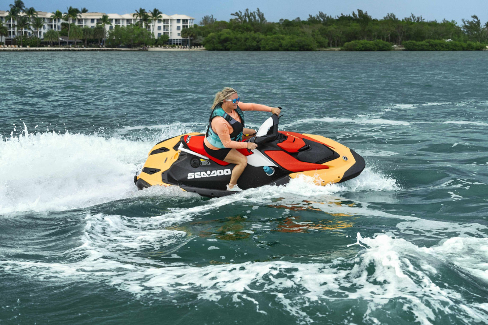 Woman riding a recreational Sea-Doo Spark personal watercraft
