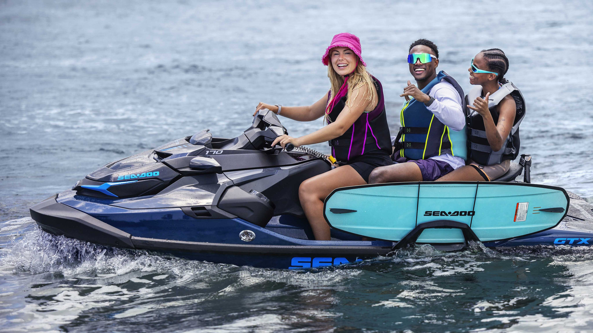 3 friends on a Sea-Doo GTX going for a wakeboard ride