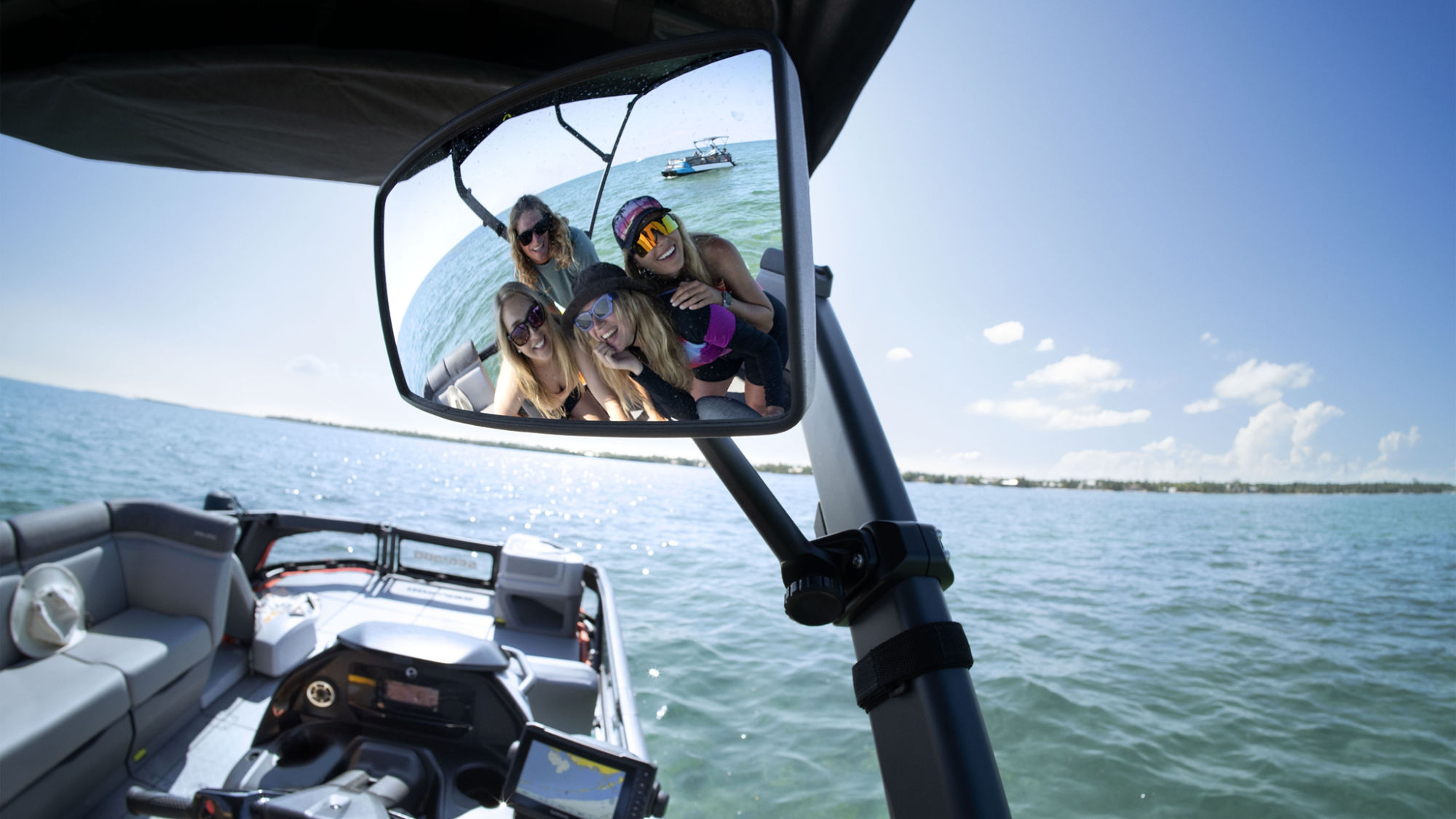 Group of friends taking a picture in a Sea-Doo Switch mirror