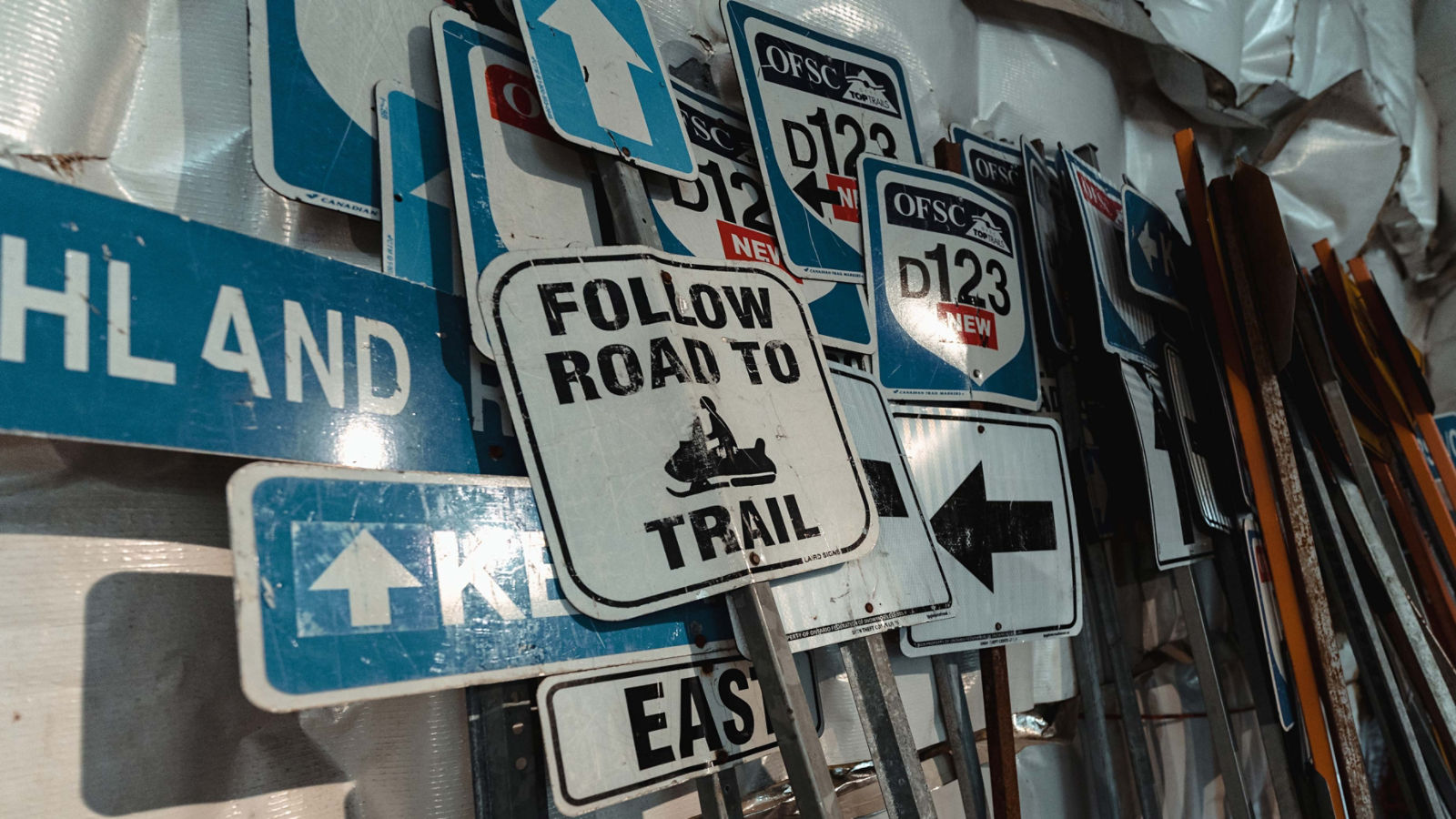 Snowmobile trails signs on a wall