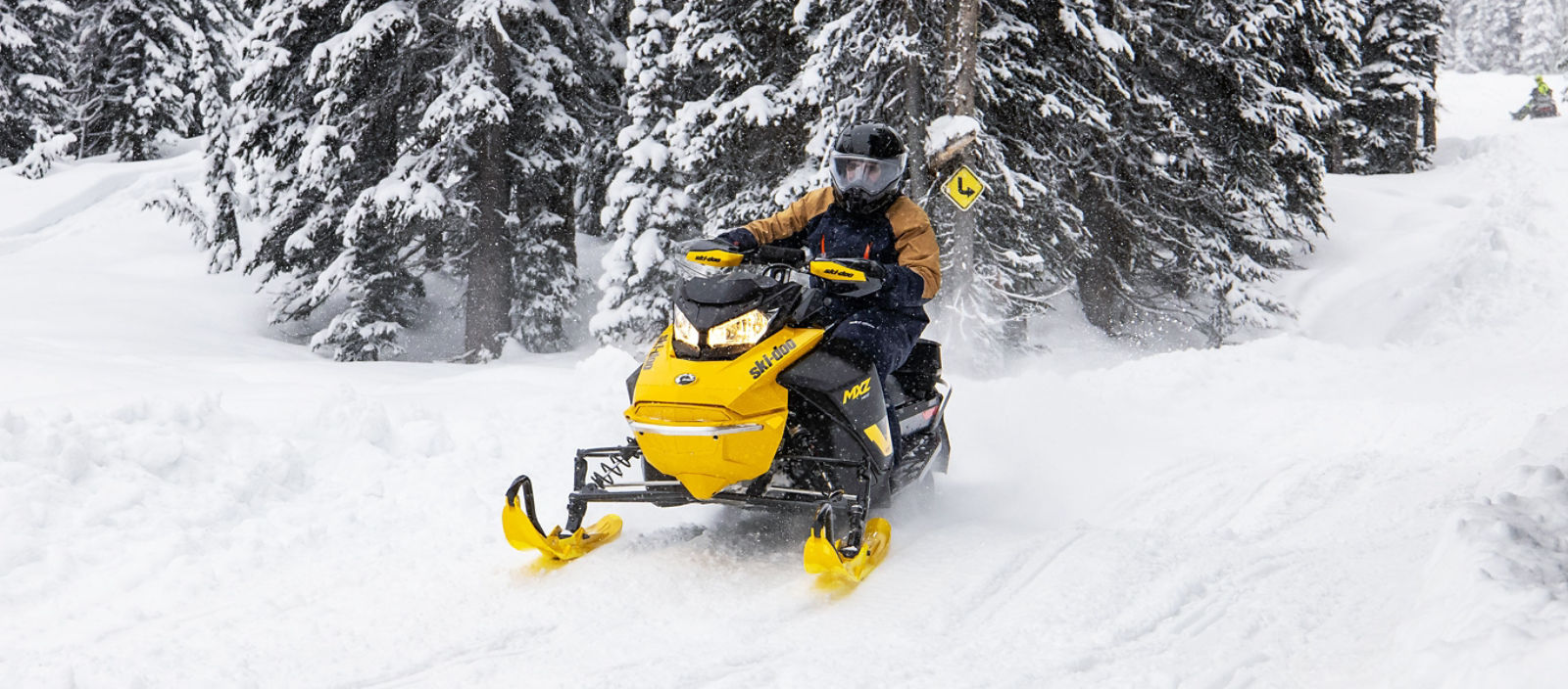 Man riding the new Ski-Doo MXZ Neo on a trail