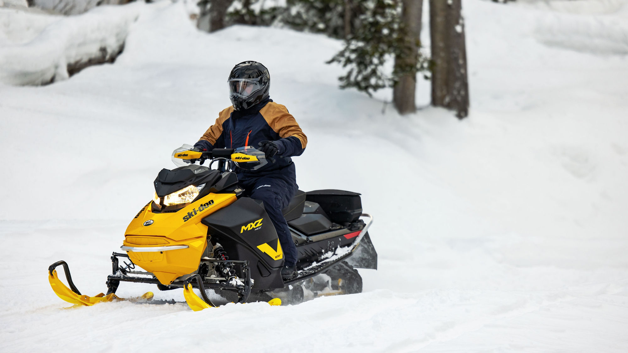 Rider on a MXZ Neo mid-sized snowmobile