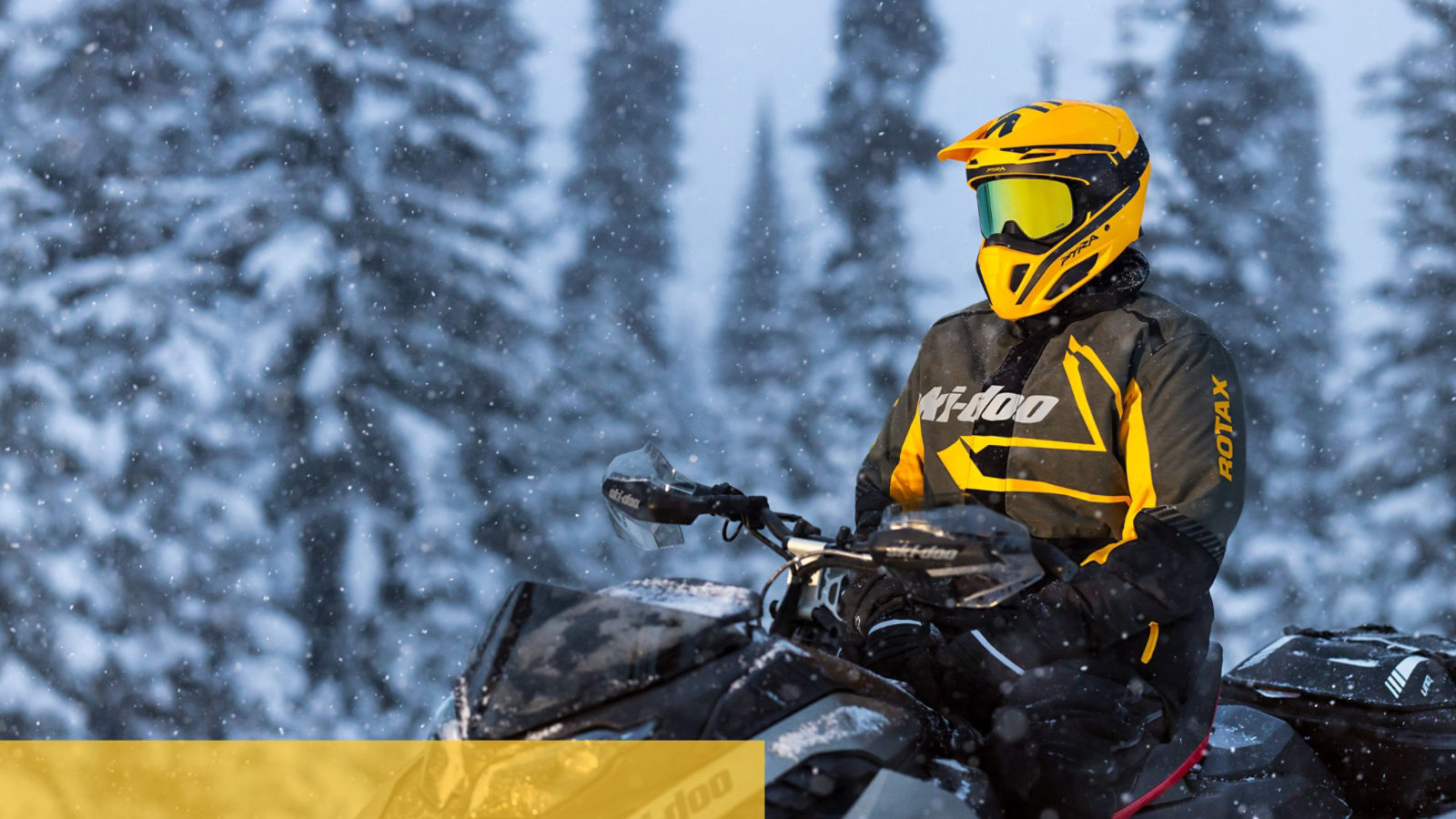 Man sitting on his new Ski-Doo Renegade snowmobile