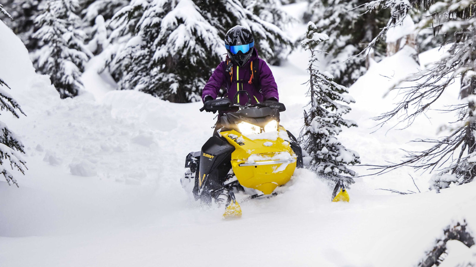 2023 Ski-Doo Summit Neo riding in the woods