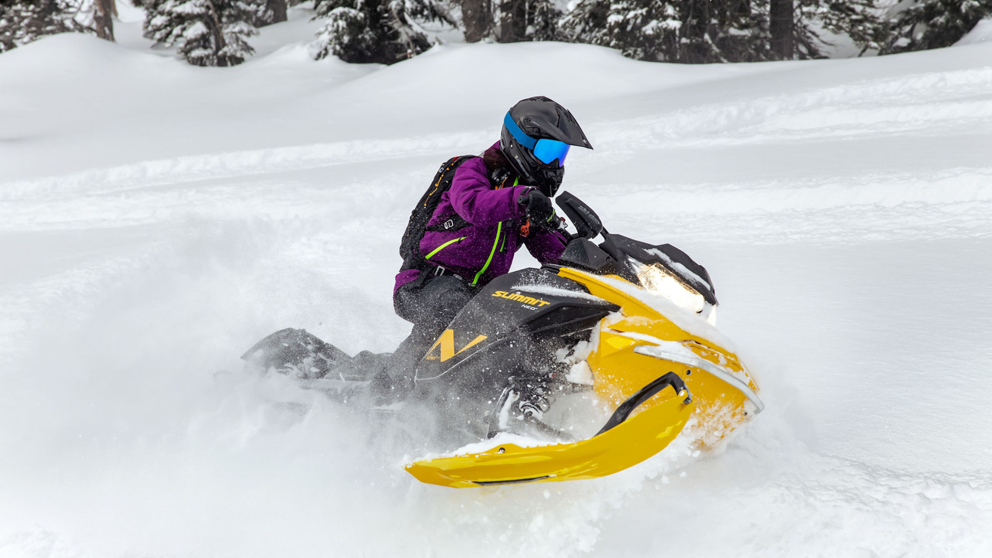 Snowmobile rider on a 2024 Ski-Doo Summit with accessories