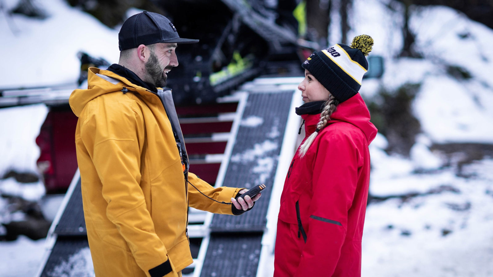 Man validating avalanche transceiver of a friend before leaving for the mountain