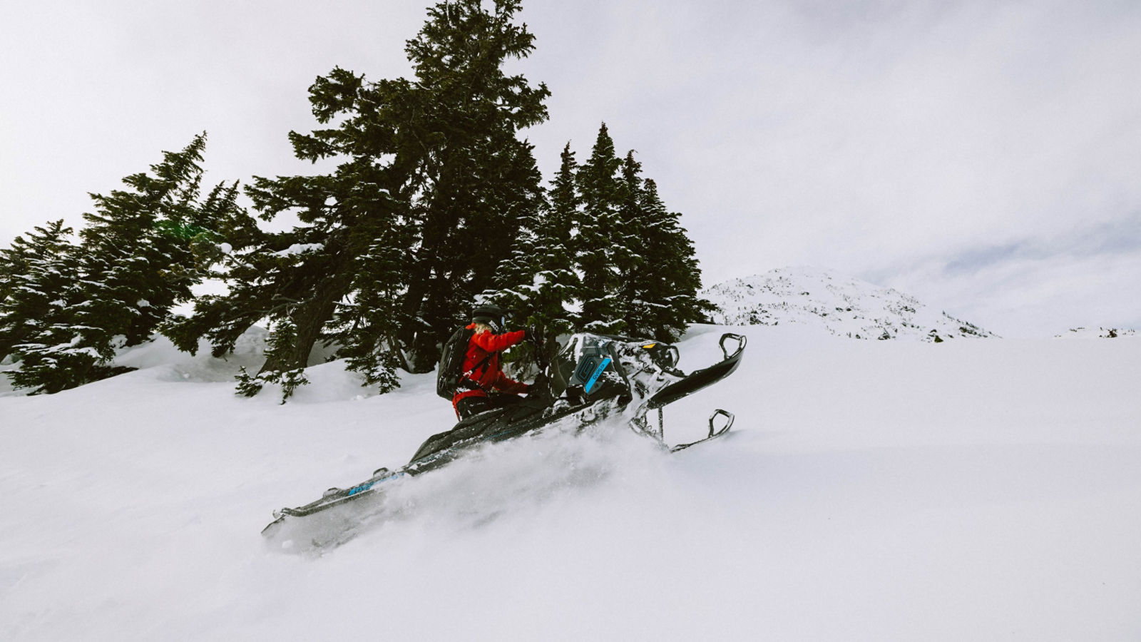 Man on their Ski-Doo snowmobiles