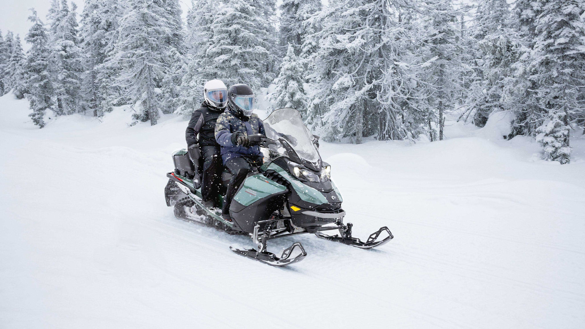 Couple on the 2024 Ski-Doo Grand Touring LE