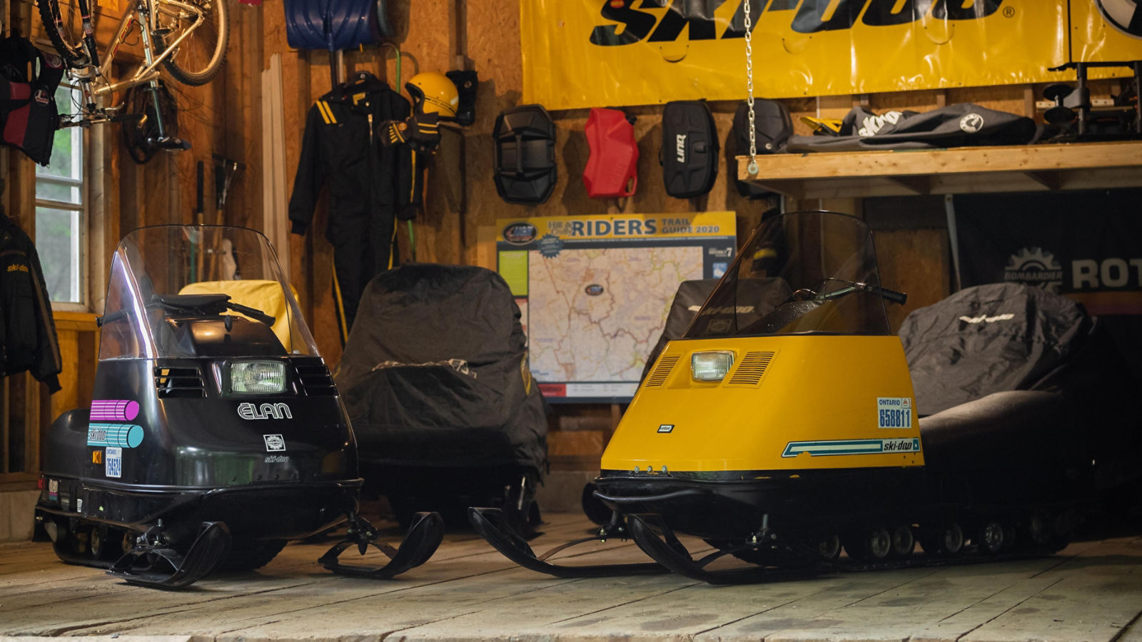 Vintage Ski-Doo sleds in a garage