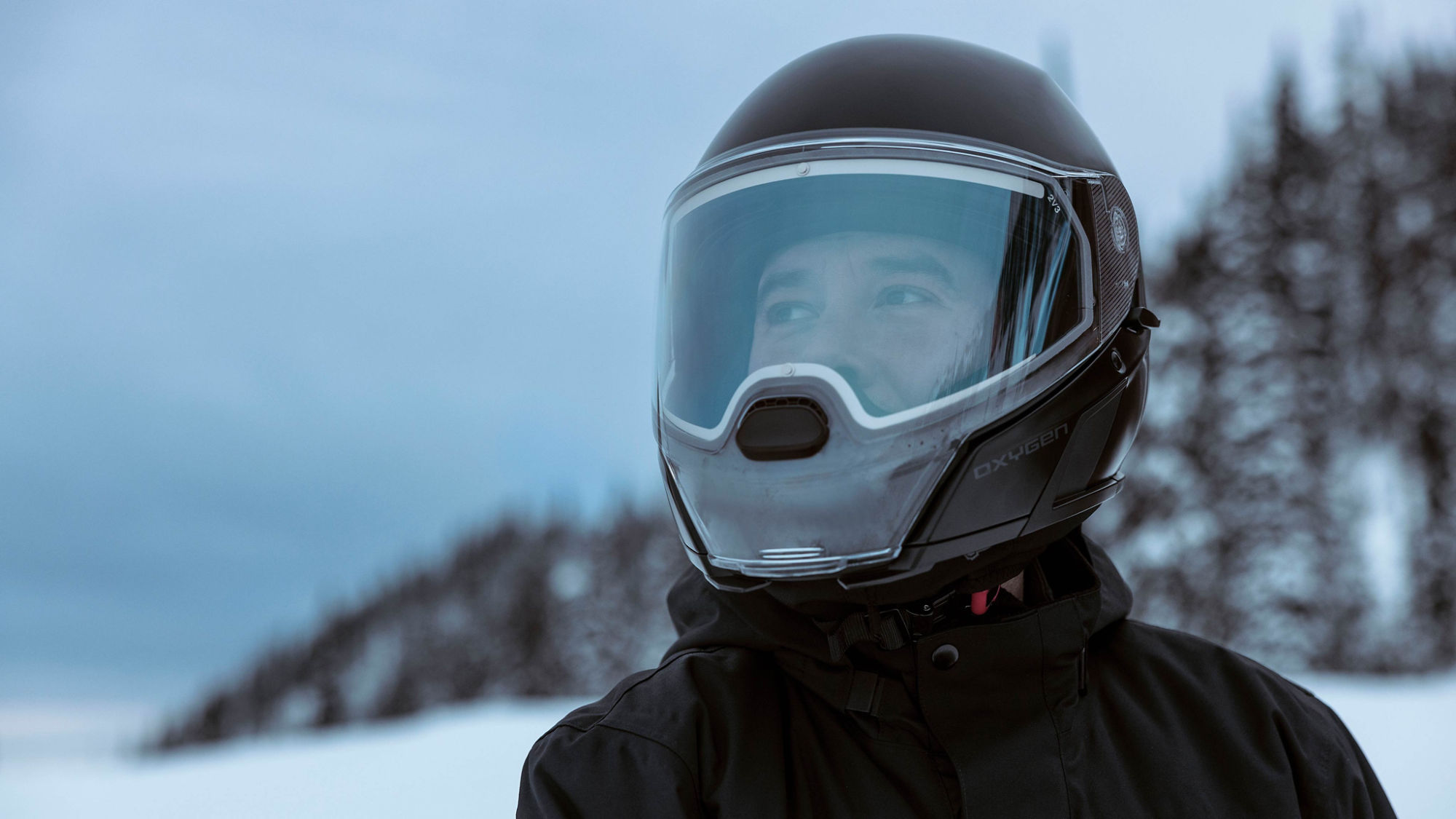 Snowmobile rider wearing a Oxygen helmet