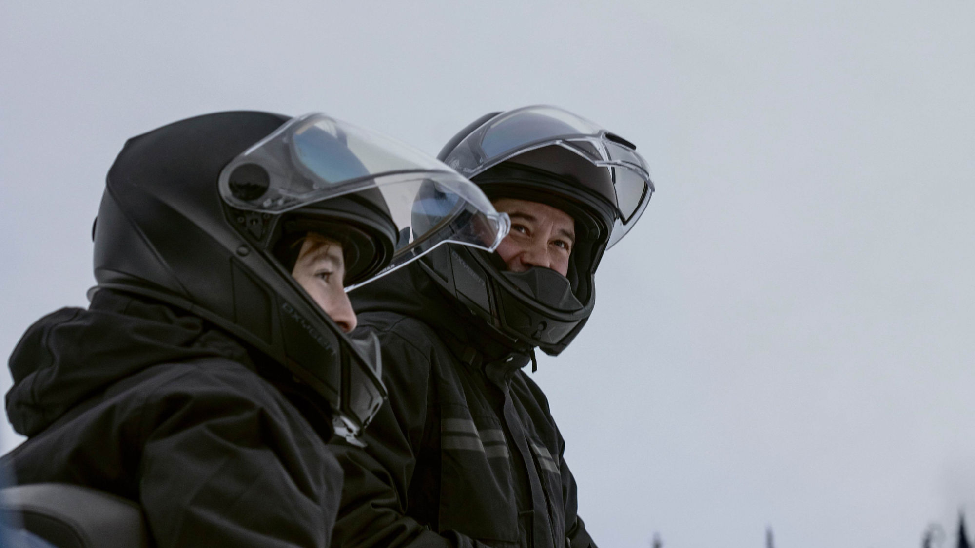Snowmobile riders wearing Oyxgen safety helmets