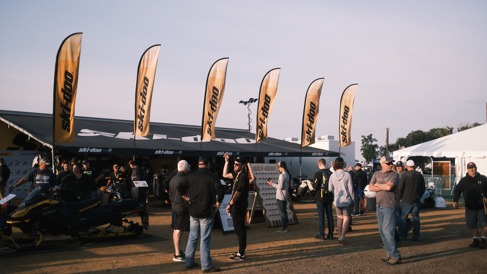 Ski-Doo snowmobile enthusiasts waiting in line for the Hay Days yearly event