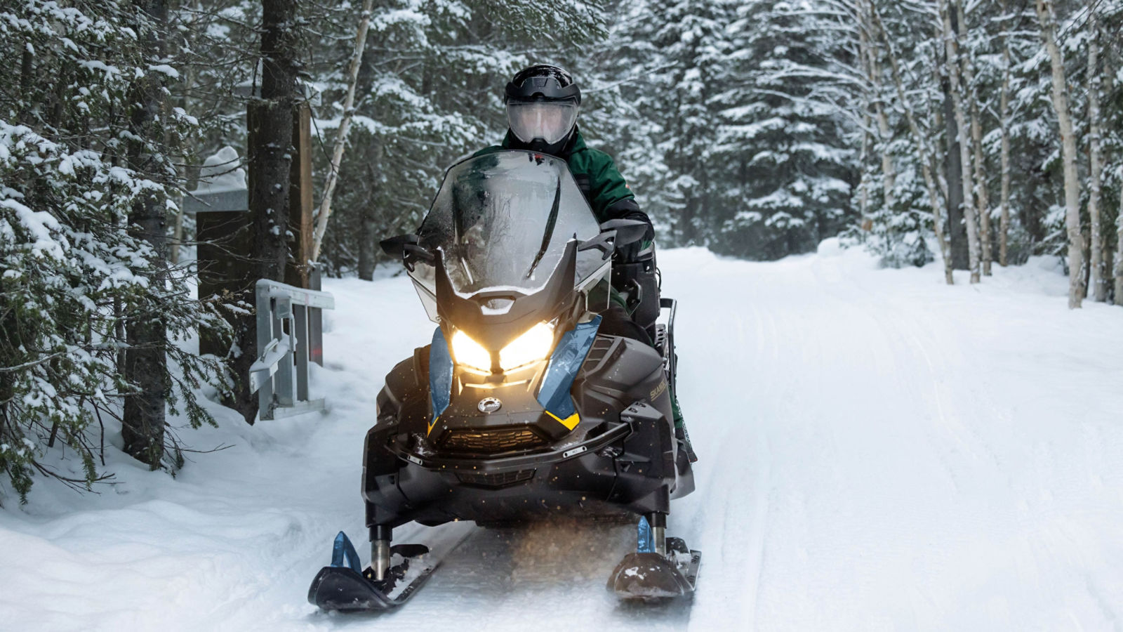 2025 Ski-Doo Skandic sport utility snowmobile in action