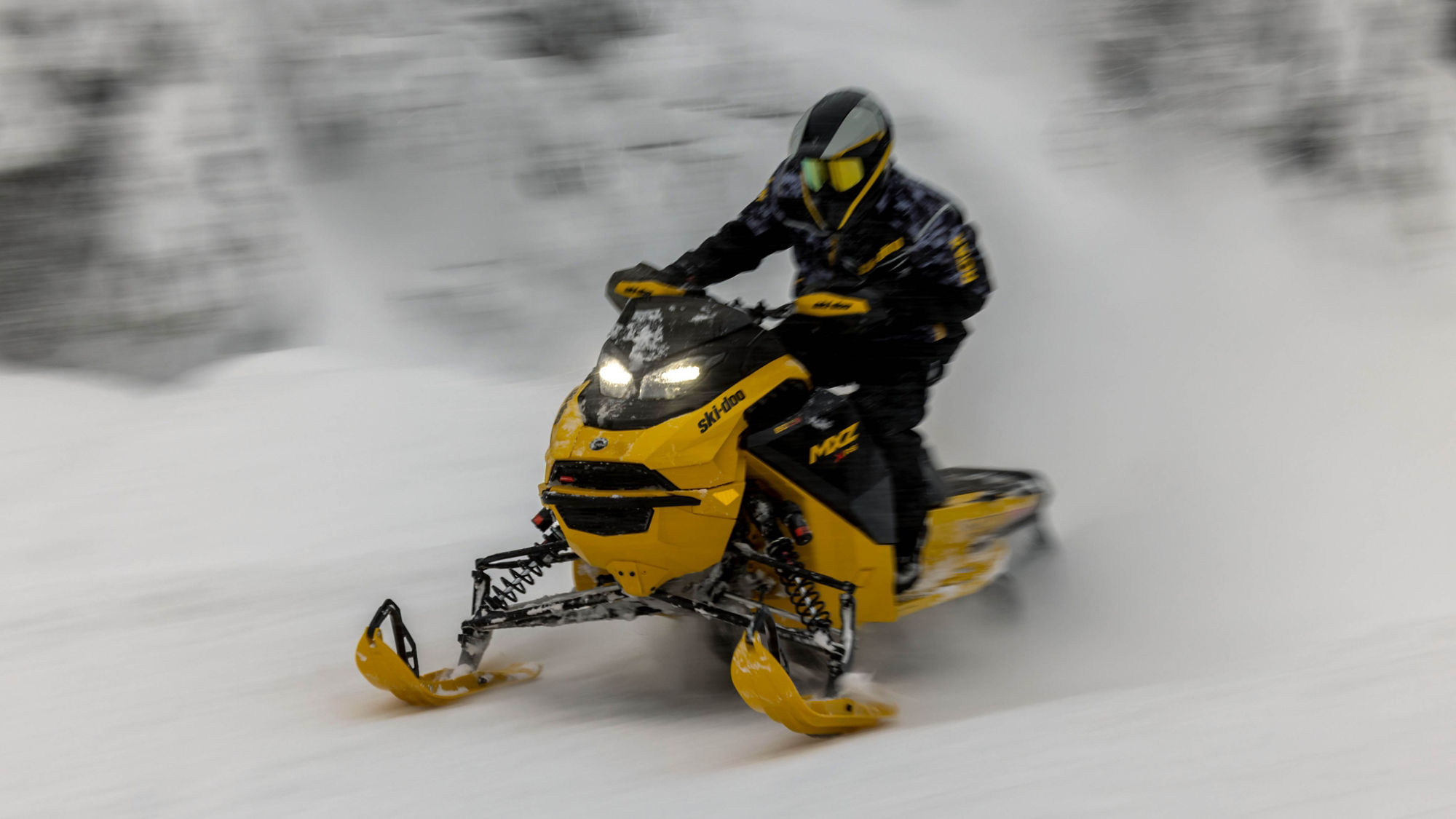 2025 Ski-Doo MXZ trail snowmobile riding at high speed
