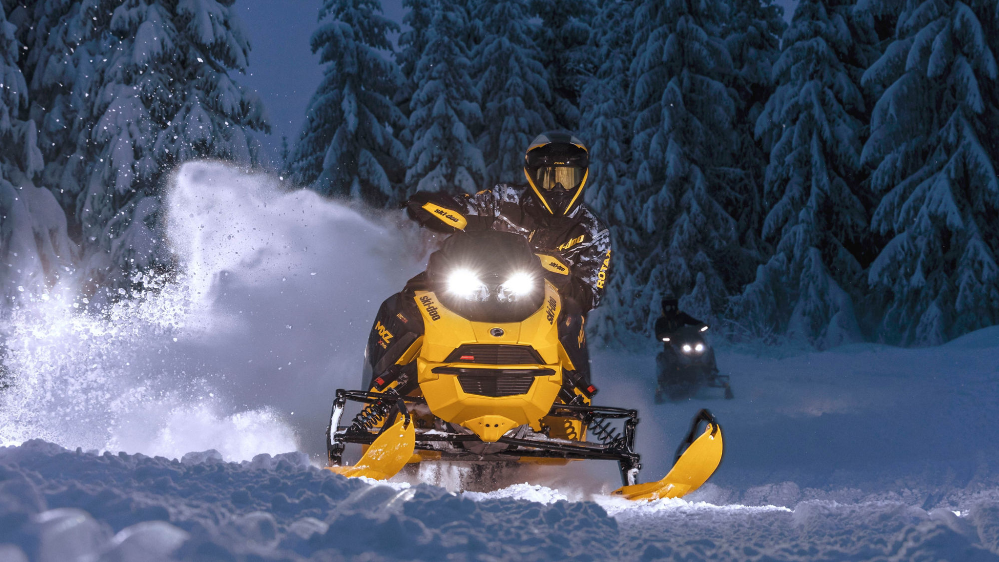 Ski-Doo MXZ 2025 snowmobile on a night ride