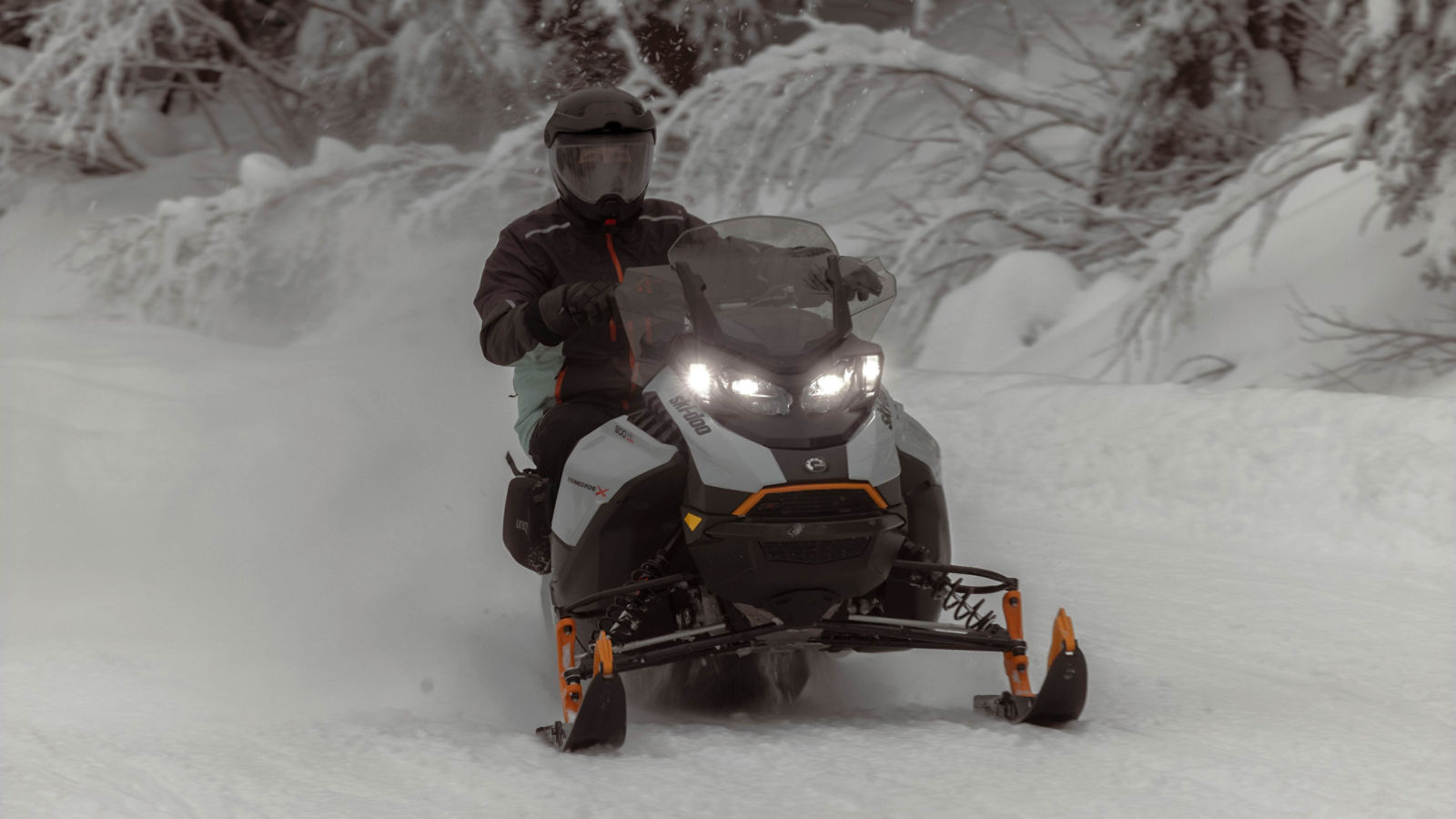 Man on a 2025 Ski-Doo Renegade X snowmobile