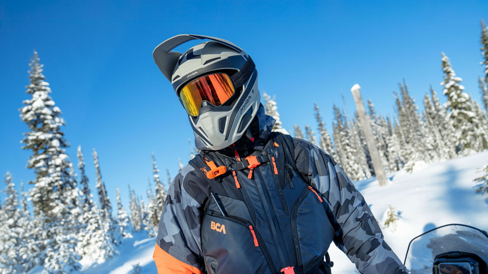 Snowmobile rider wearing a Pyra ECE certified safety helmet