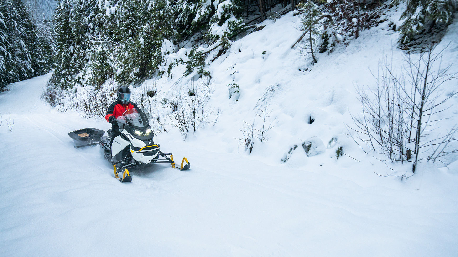 2026 Ski-Doo Experience electric snowmobile pulling a sled