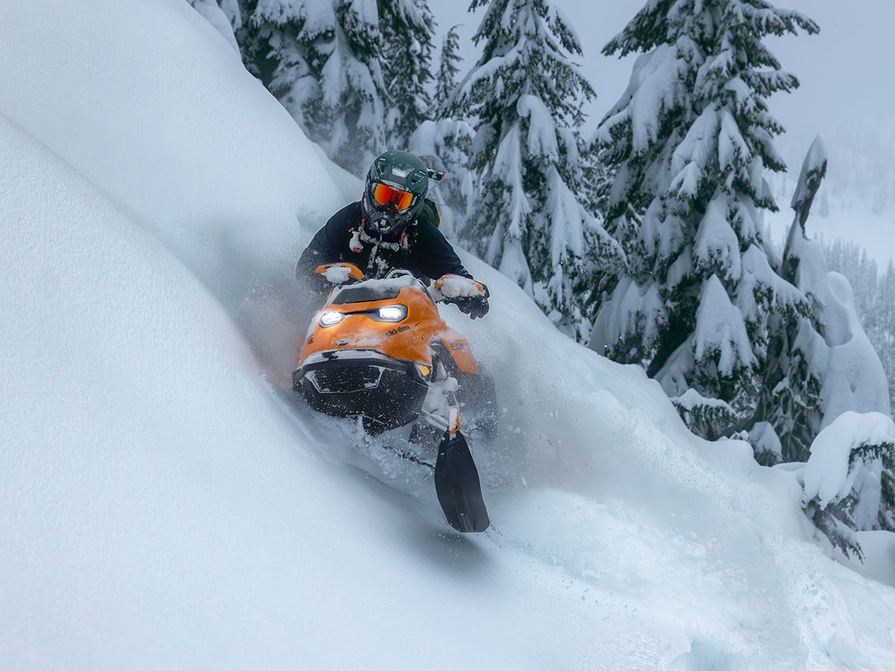 Rider standing on his 2027 Ski-Doo Freeride 850 E-Tec Turbo R