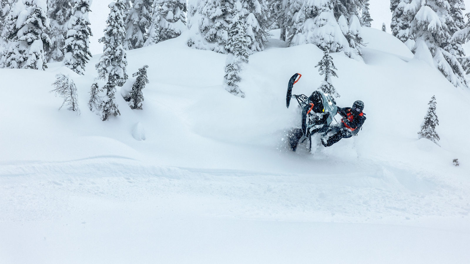 Rider performing a wheelie in deep snow with a 2027 Ski-Doo Summit Edge