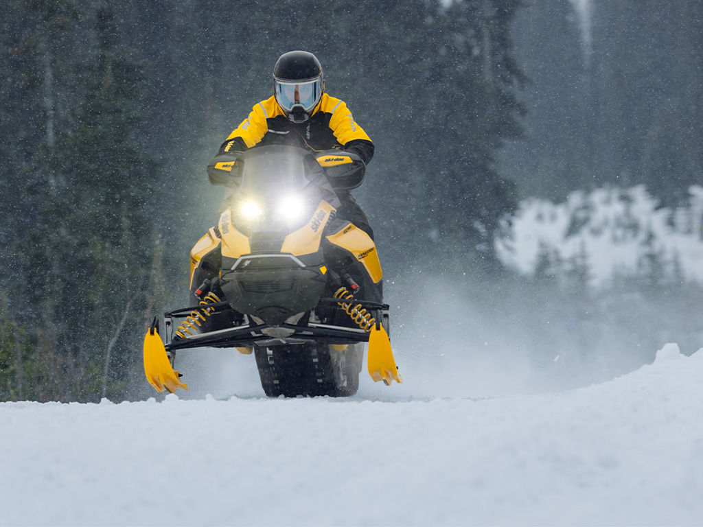Rider going at high speed on a 2027 Ski-Doo Renegade snowmobile