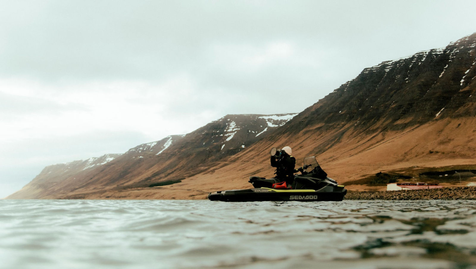 3 surfers from behind watching the waves