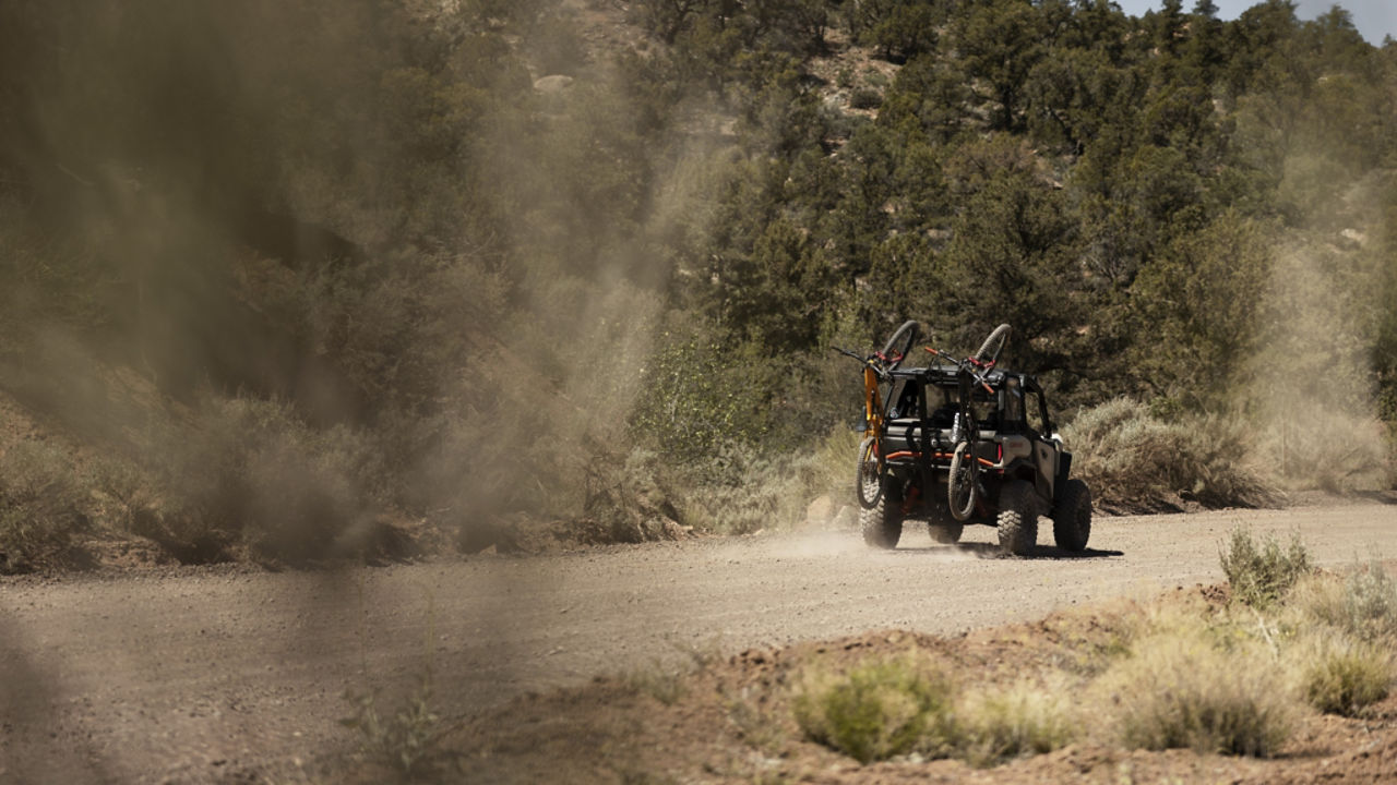 Can-Am driving on a gravel road