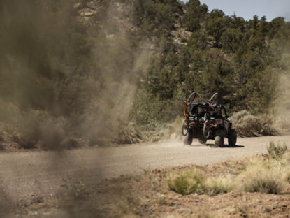 Can-Am driving on a gravel road