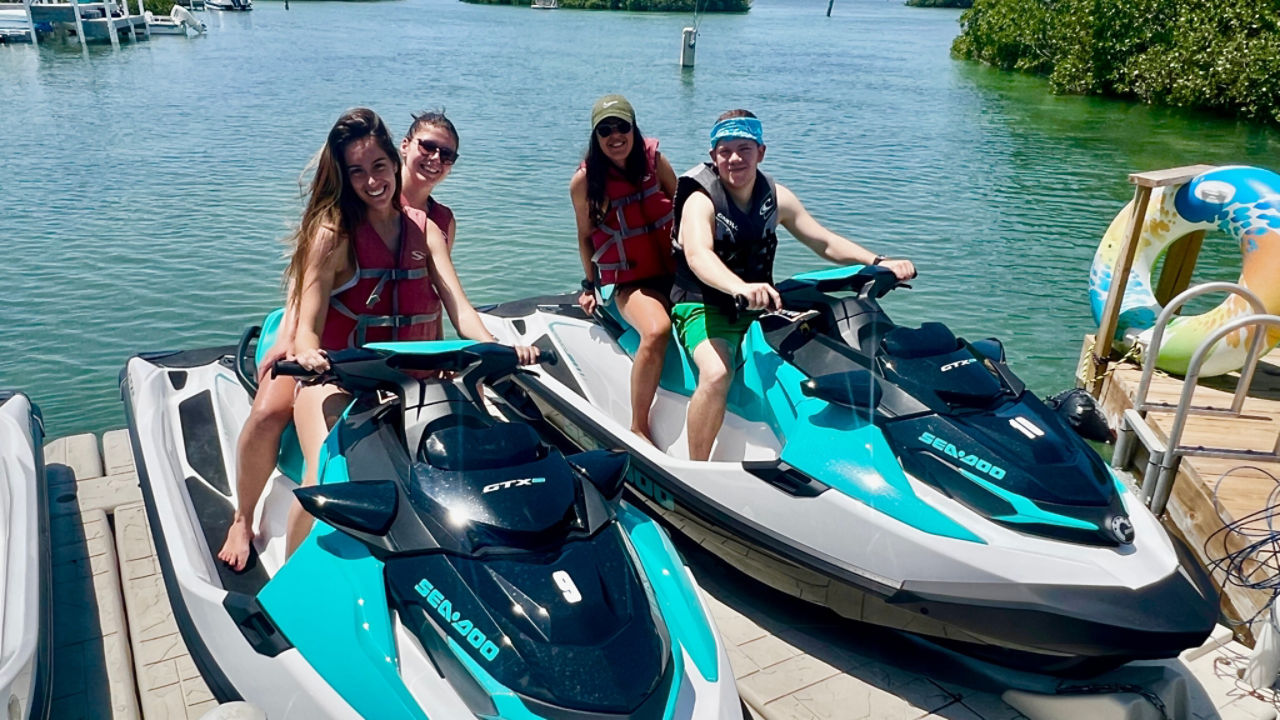 a group of happy riders on Sea-Doos