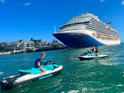 sea-doo riders next to a cruiseship