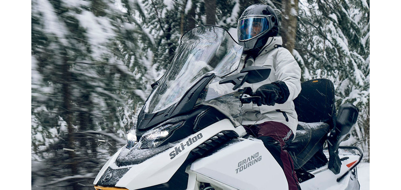 Ski-Doo EV zooming through the forest