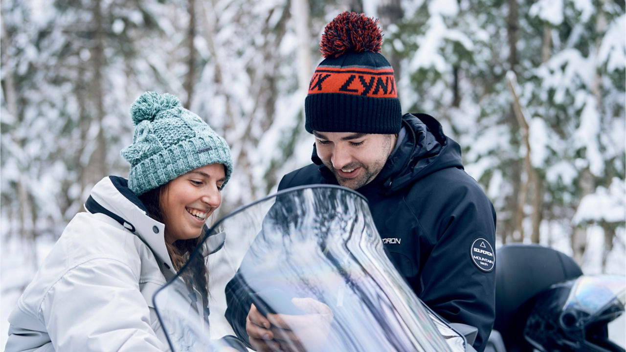 couples' chat on an electric Ski-Doo