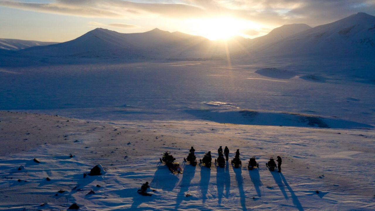 drone shot of a group overlooking Svalbard landscape