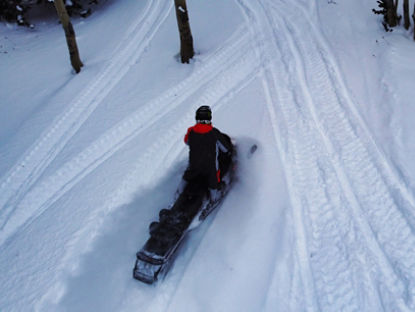 drone shot of a ski-doo rider in utah